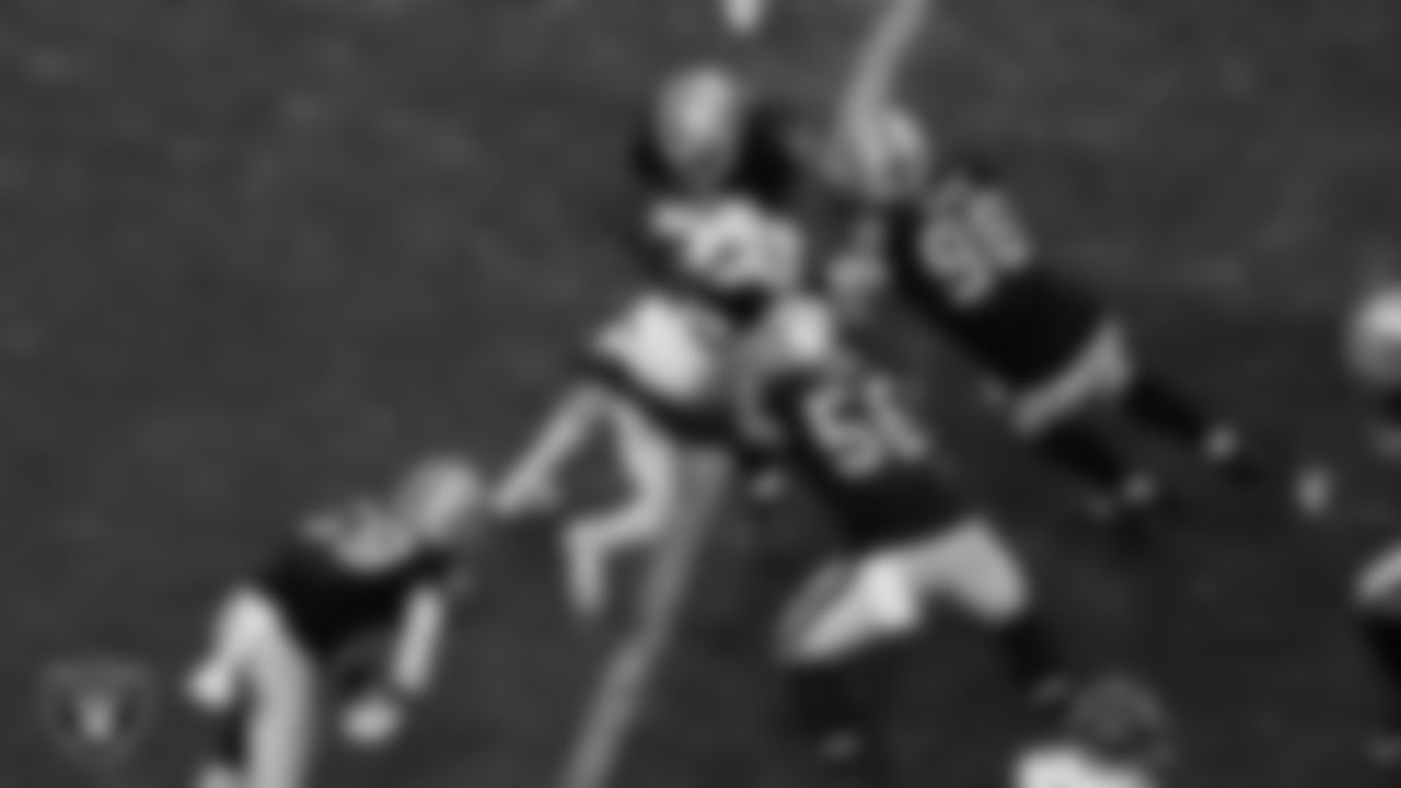 Las Vegas Raiders linebacker Luke Masterson (59), defensive tackle Bilal Nichols (91), linebacker Harvey Langi (56) and defensive end Maxx Crosby (98) during the regular season home game against the Kansas City Chiefs at Allegiant Stadium.