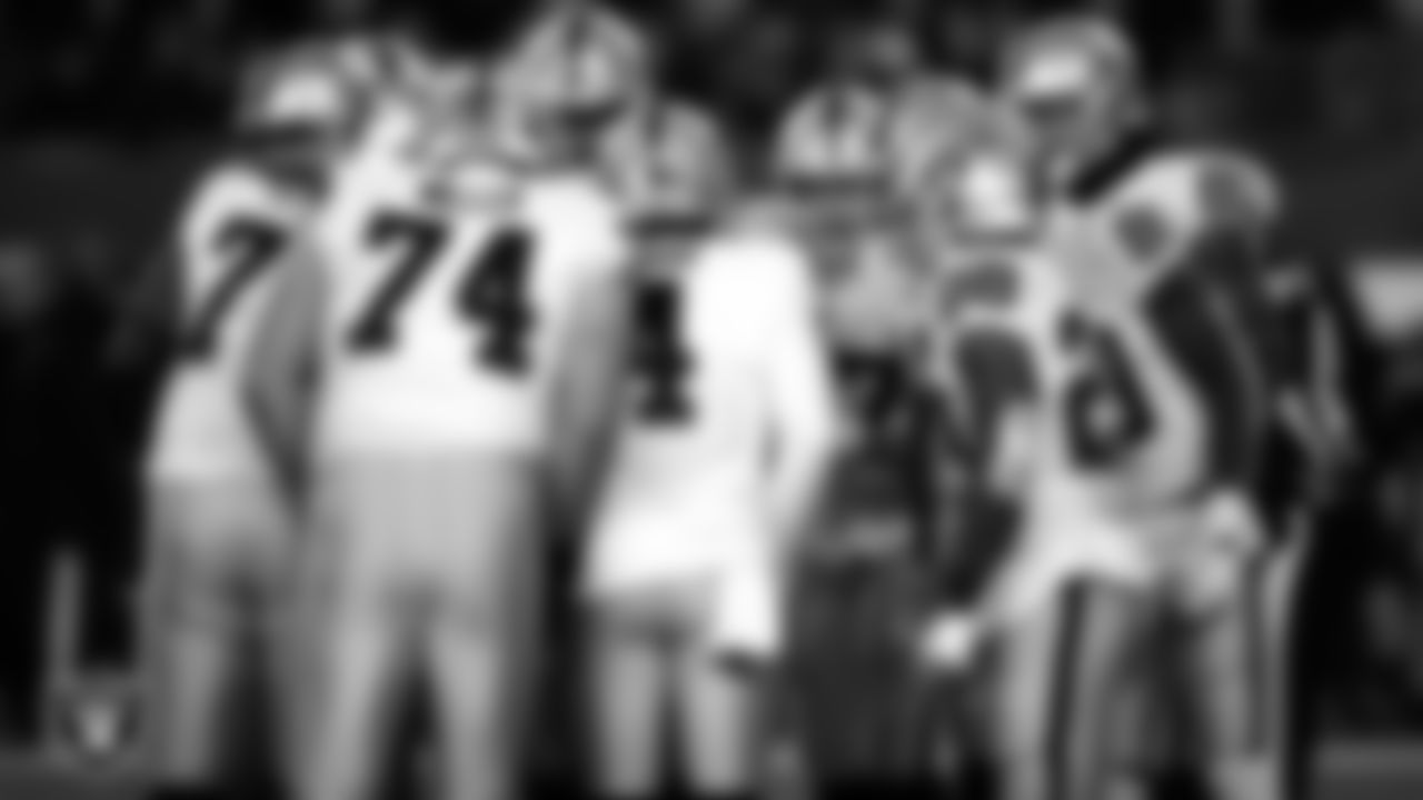 The Las Vegas Raiders offense huddles during the postseason away game against the Cincinnati Bengals.