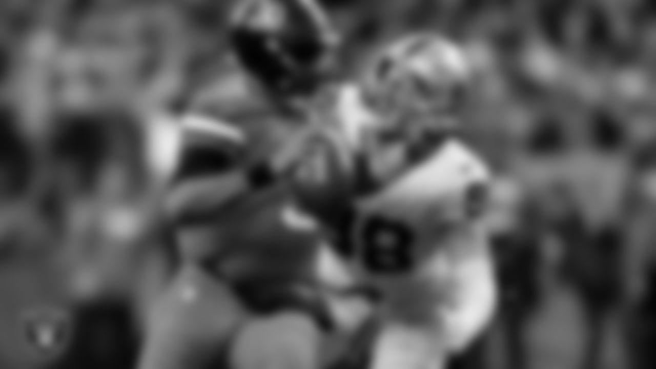 Las Vegas Raiders defensive end Maxx Crosby (98) sacks the quarterback during the regular season away game against the Denver Broncos at Empower Field at Mile High.