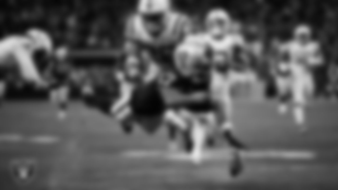 Las Vegas Raiders wide receiver Davante Adams (17) dives into the end zone on a 48-yard touchdown catch during the regular season home game against the Indianapolis Colts at Allegiant Stadium.
