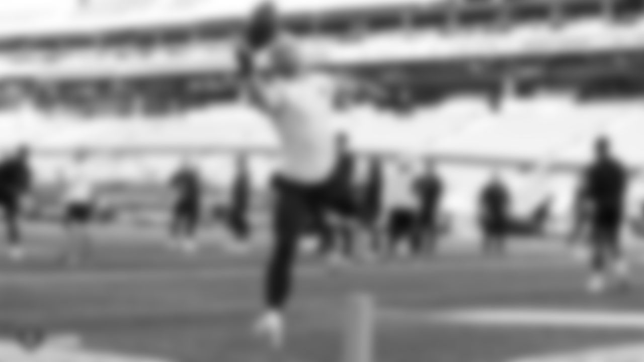The Raiders warm up before their preseason game against the Green Bay Packers at IG Field.