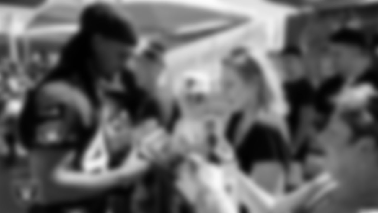 Las Vegas Raiders cornerback Azizi Hearn (48) signs autographs for fans after practice at 2023 Training Camp at Intermountain Health Performance Center.