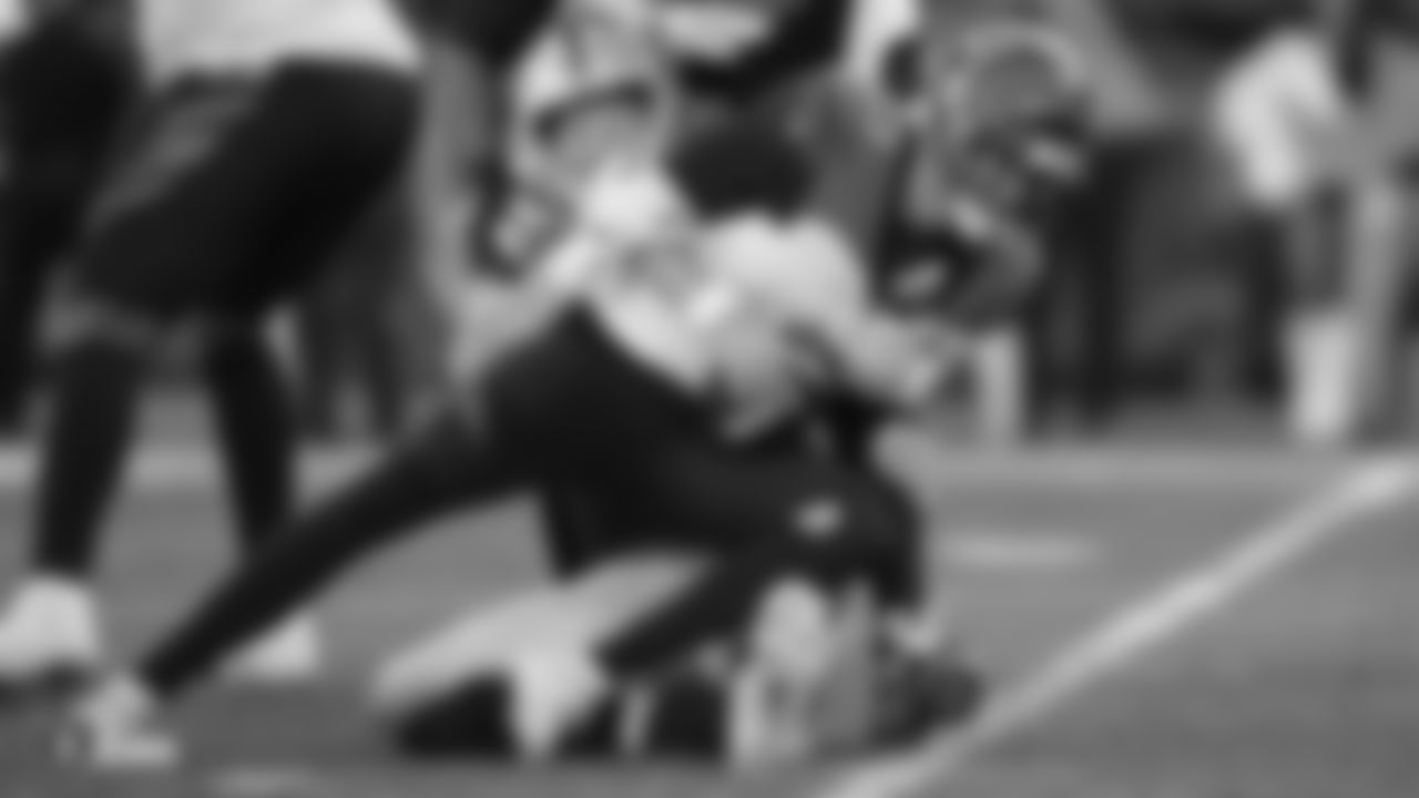 Raiders defensive end Maxx Crosby (98) sacks the quarterback during the regular season game against the Cincinnati Bengals.