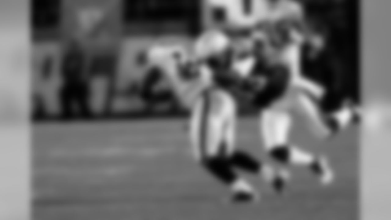 WR Jacoby Ford holds on for the catch.