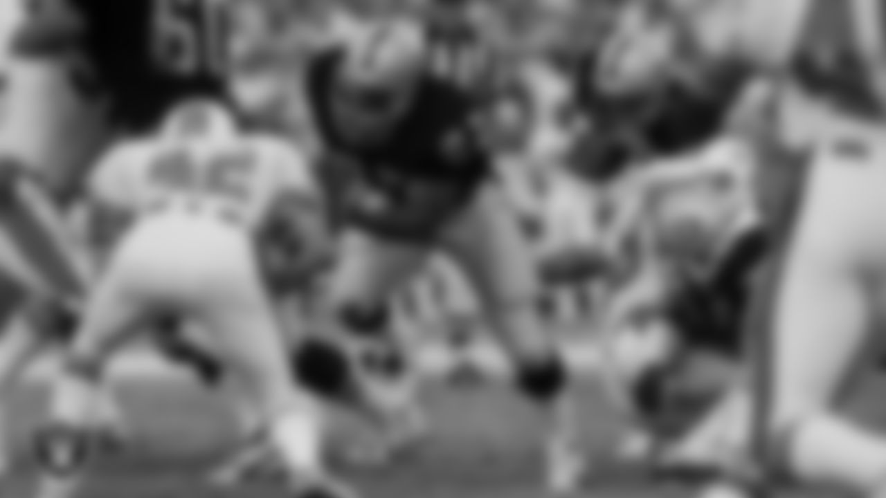 Raiders running back Frank Hawkins (27) blocks for running back Marcus Allen (32) during the regular season away game against the Miami Dolphins at the Miami Orange Bowl, Sunday, December 2, 1984, in Miami, Fla.