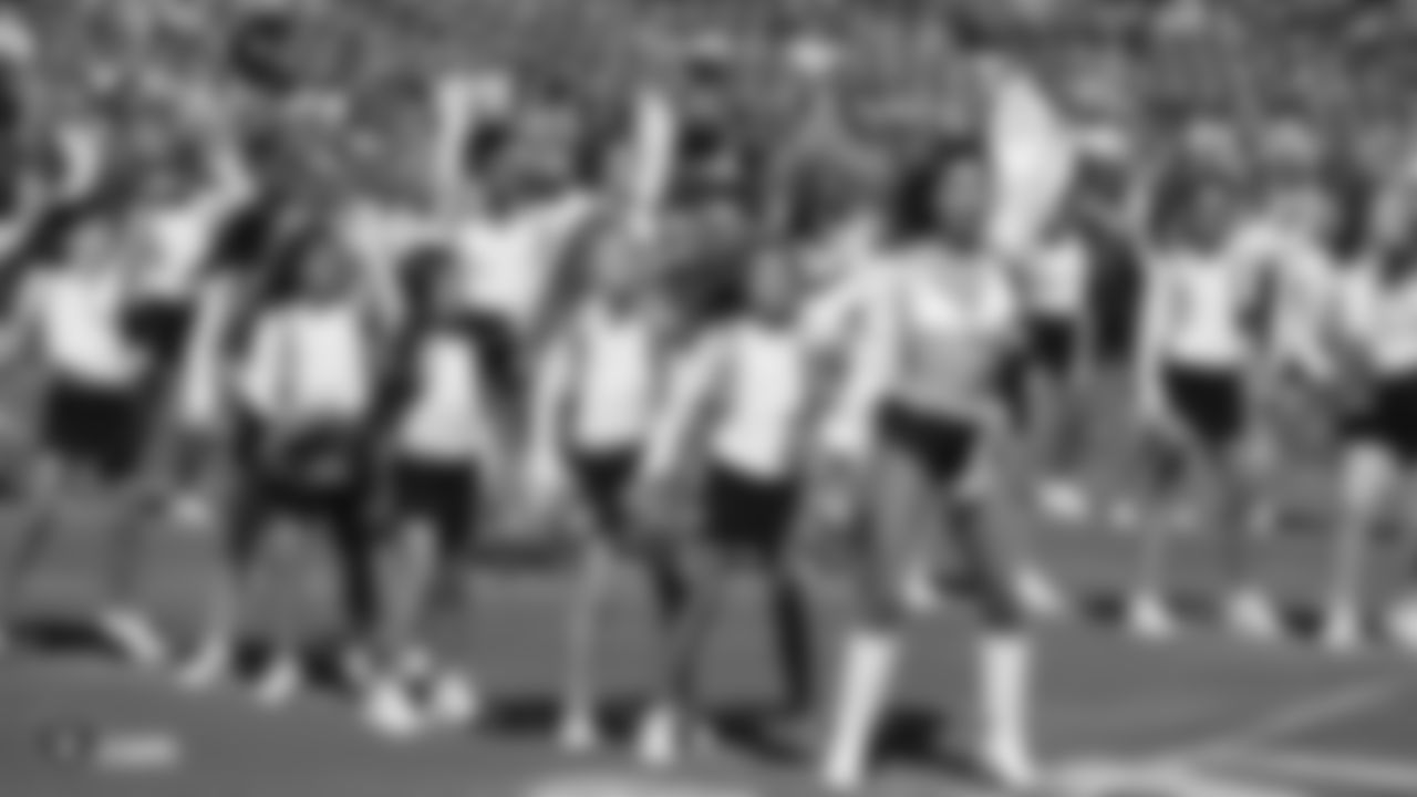 The Raiderettes and Junior Raiderettes perform on the field before the Raiders game against the Los Angeles Rams.
