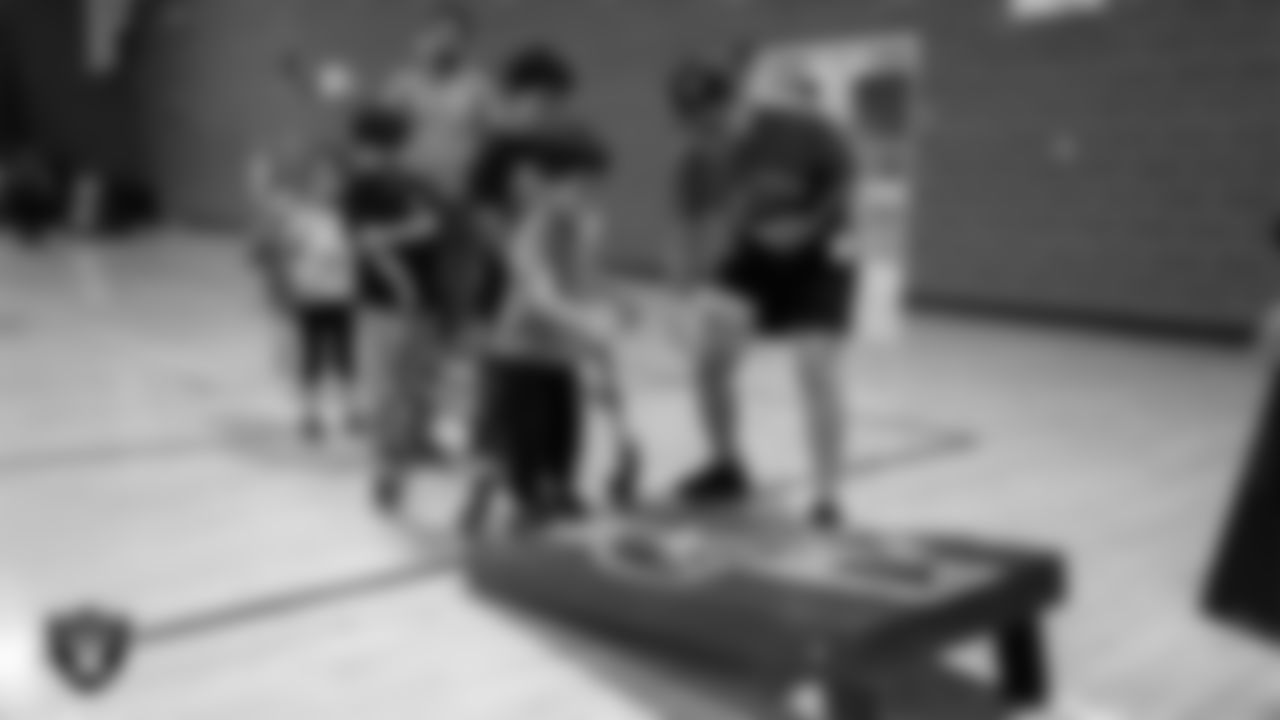 A youth community member enjoys Las Vegas Raiders Stretch & Move activities during CCSD's Paralympic Night at J.D. Smith Middle School.