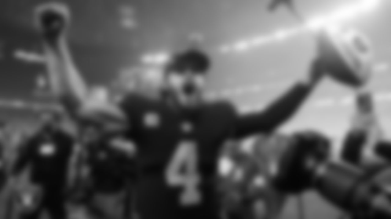 Las Vegas Raiders quarterback Derek Carr (4) celebrates on his way to the locker room after the regular season game against the Los Angeles Chargers.