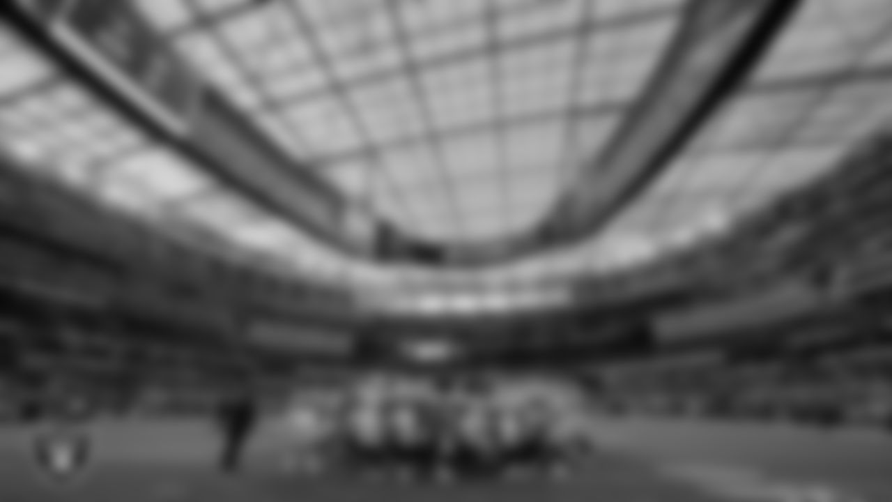 The Las Vegas Raiders huddle before the preseason game against the Los Angeles Rams at SoFi Stadium.