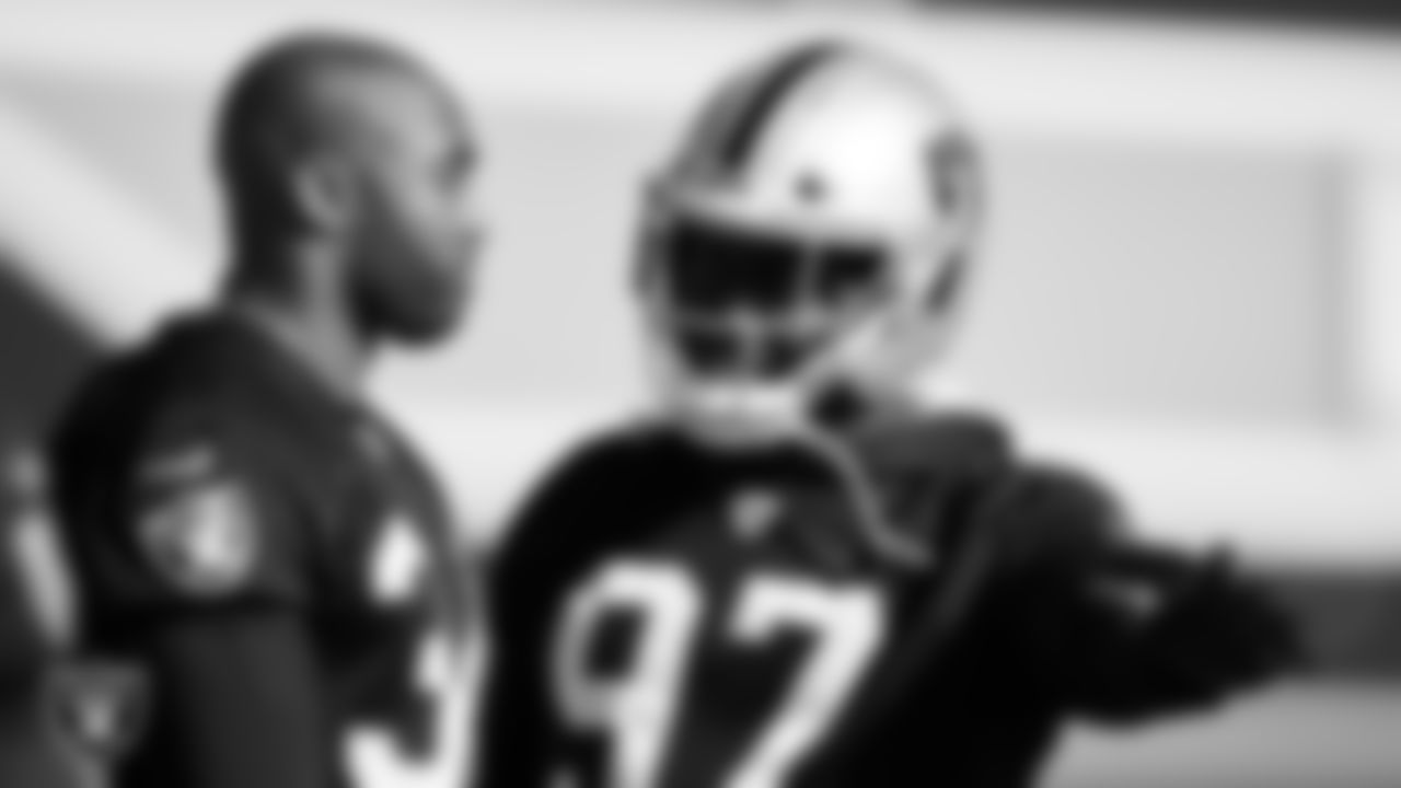 Las Vegas Raiders linebacker K.J. Wright (34) and defensive tackle Damion Square (97) during practice at Intermountain Healthcare Performance Center.