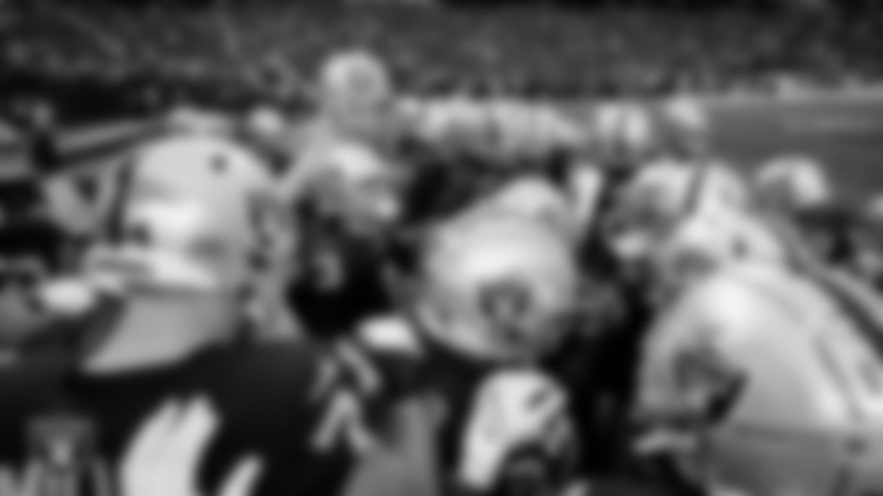 The Las Vegas Raiders huddle during warm ups before the regular season home game against the San Francisco 49ers at Allegiant Stadium.