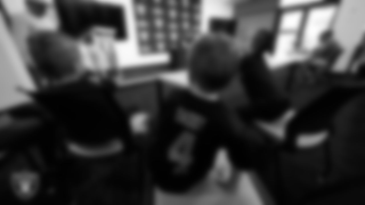 Las Vegas Raiders quarterback Derek Carr's (4) kids during a press conference after he signed a contract extension.