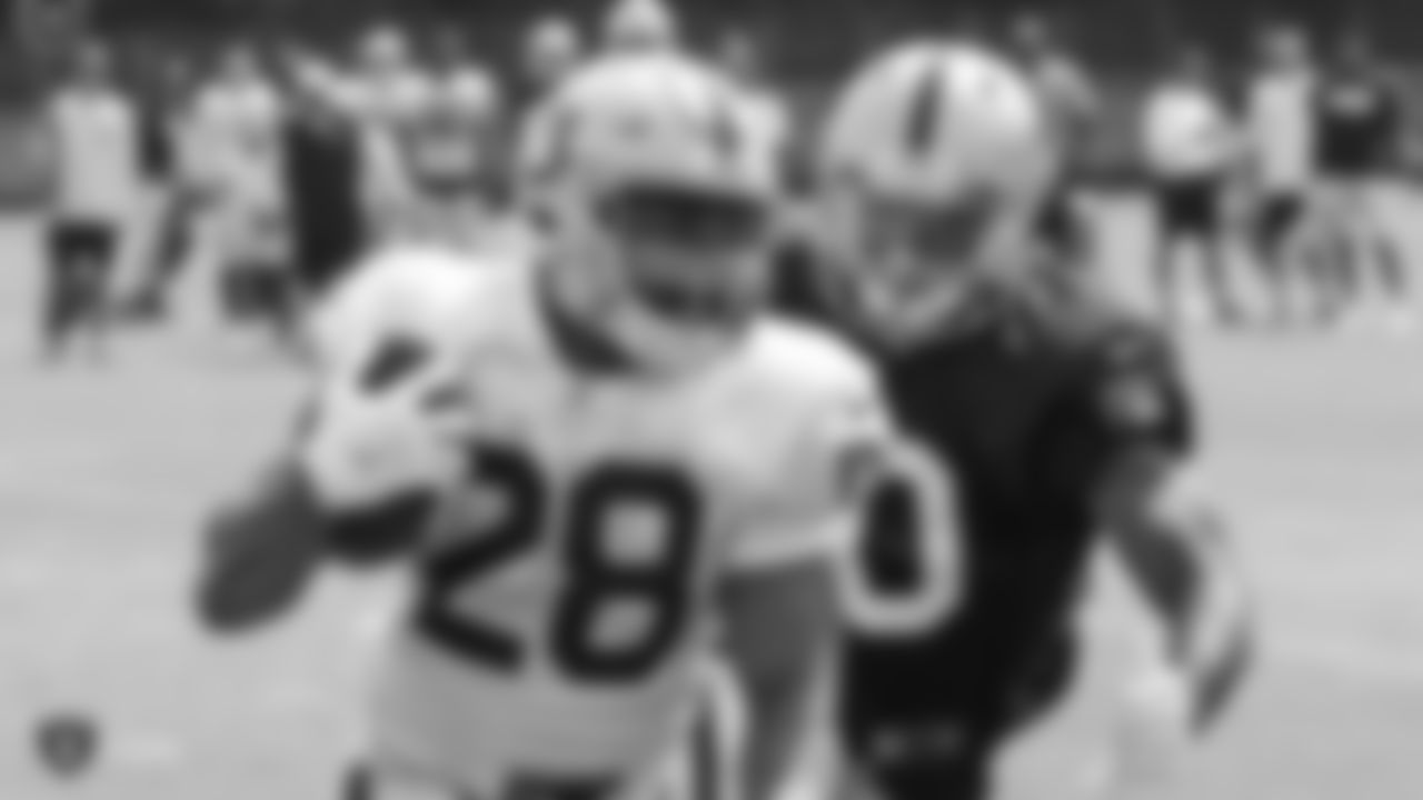 Oakland Raiders running back Doug Martin (28) and linebacker Nicholas Morrow (50) on the field for practice at 2018 Training Camp at The Oakland Raiders Napa Valley Training Complex, Friday, August 3, 2018, in Napa, California.