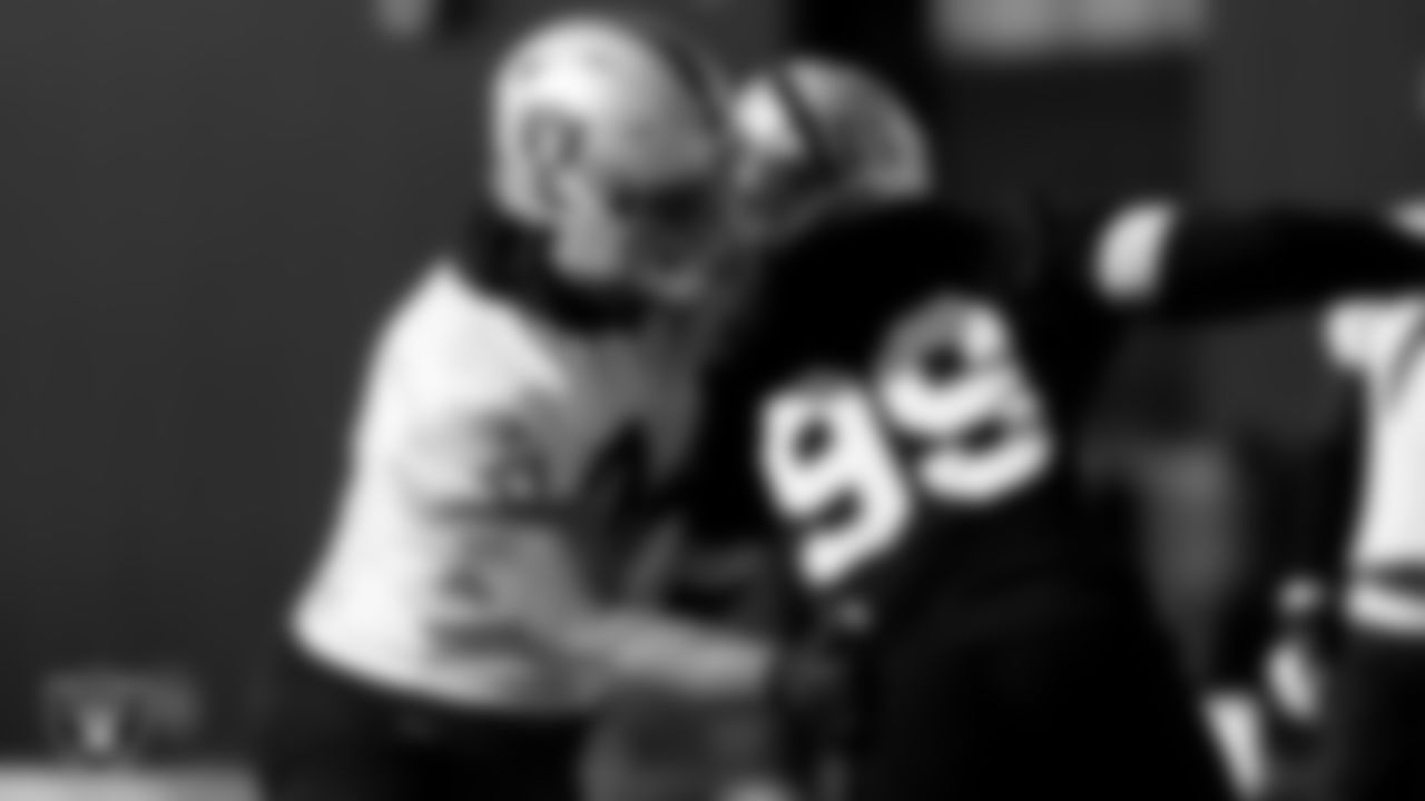 Las Vegas Raiders tackle Kolton Miller (74) and defensive end Arden Key (99) during practice at Intermountain Healthcare Performance Center.