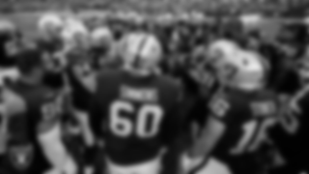 Las Vegas Raiders defensive tackle Damion Square (97) fires the team up in a huddle during warm ups before the regular season home game against the Washington Football Team.