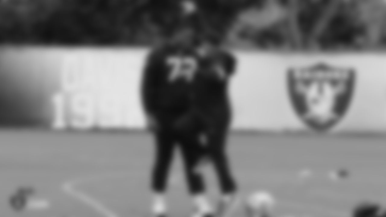 Raiders tackle Trent Brown (77) and Head Coach Jon Gruden on the field for practice.