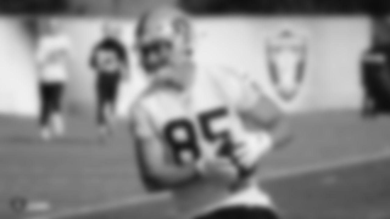 Raiders tight end Derek Carrier (85) runs after making a catch during practice.