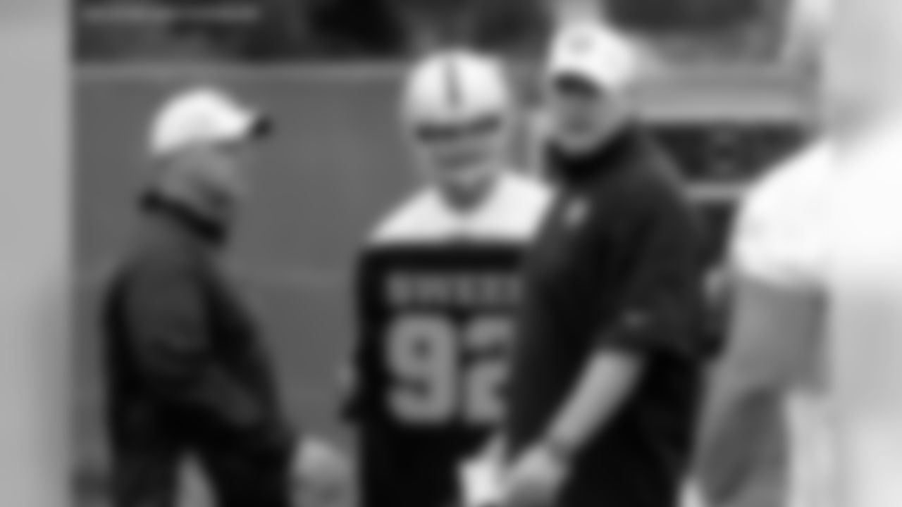 Offensive line coaches Frank Pollack and Steve Wisniewski work with their line.