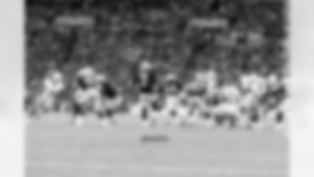 Marquette King punts the ball away.