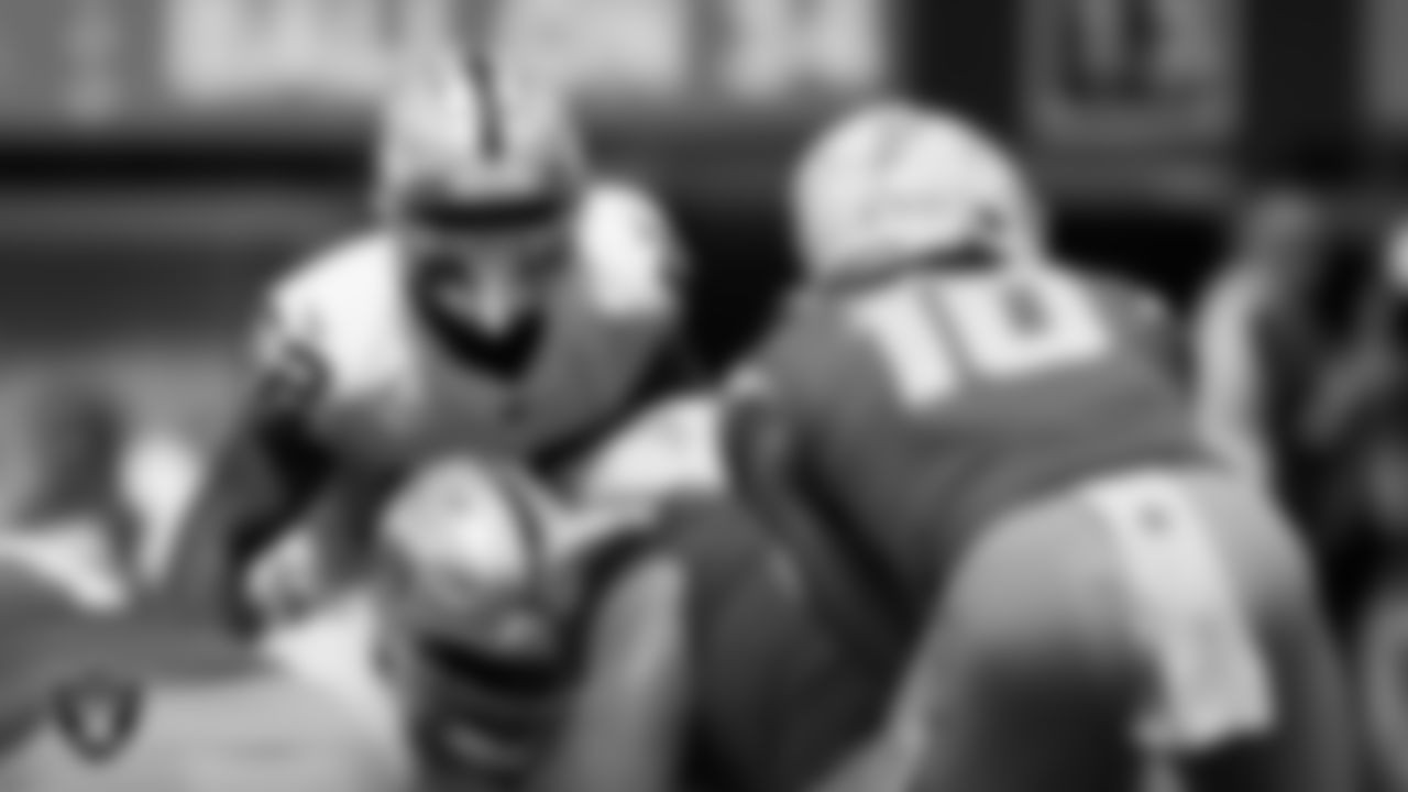 Las Vegas Raiders linebacker Denzel Perryman (52) eyes the quarterback during the regular season away game against the Los Angeles Chargers at SoFi Stadium.