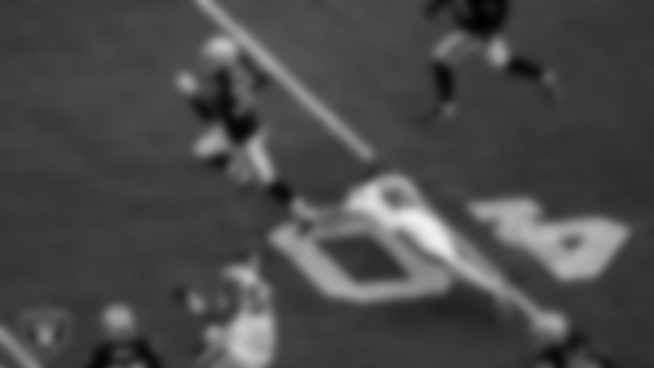Las Vegas Raiders safety Duron Harmon (30) returns an interception for a 73-yard touchdown during the regular season home game against the Houston Texans at Allegiant Stadium.