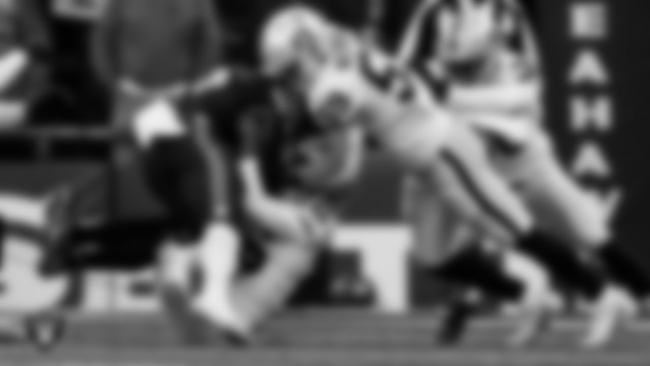 Las Vegas Raiders linebacker Luke Masterson (59) and cornerback Rock Ya-Sin (26) make a tackle during the regular season away game against the Seattle Seahawks at Lumen Field.