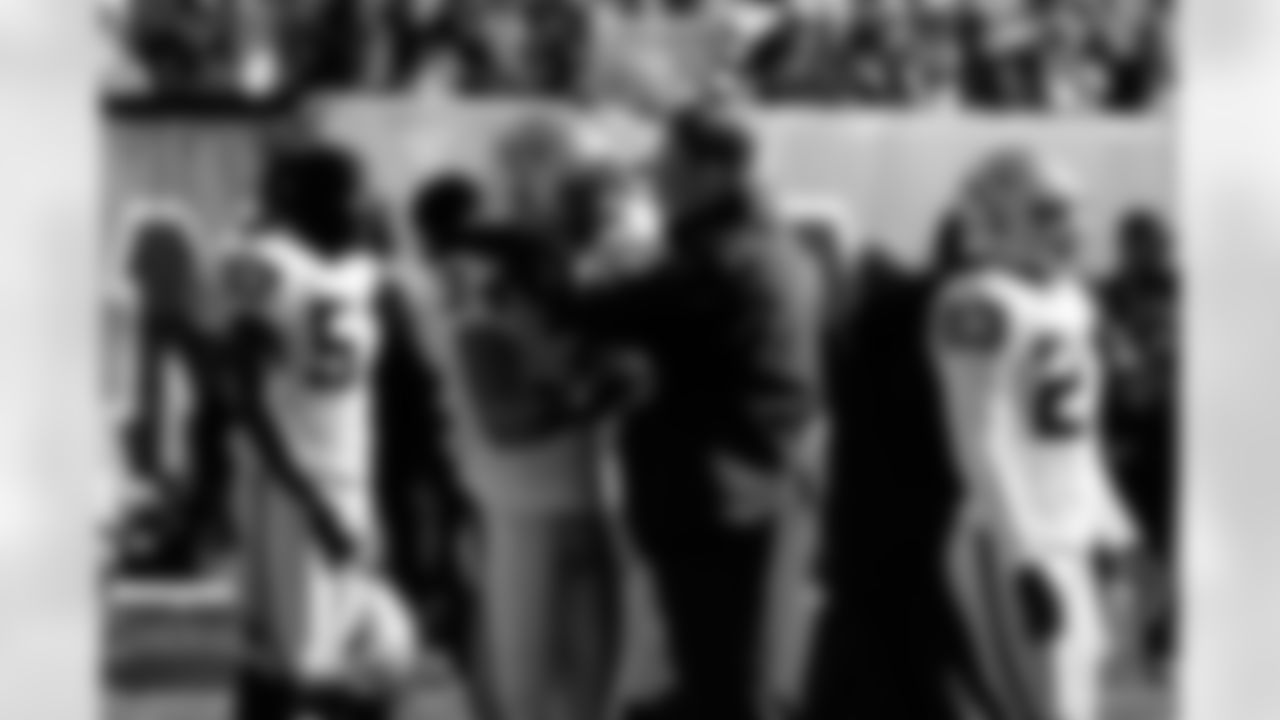 Assistant special teams coach Keith Burns spends a little time with S Mike Mitchell.