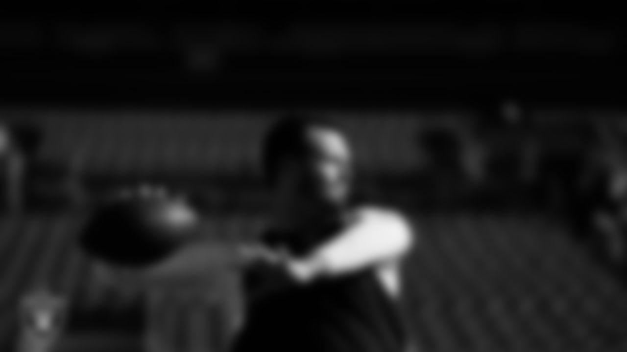 Las Vegas Raiders quarterback Derek Carr (4) warming up before the regular season away game against the Denver Broncos at Empower Field at Mile High.