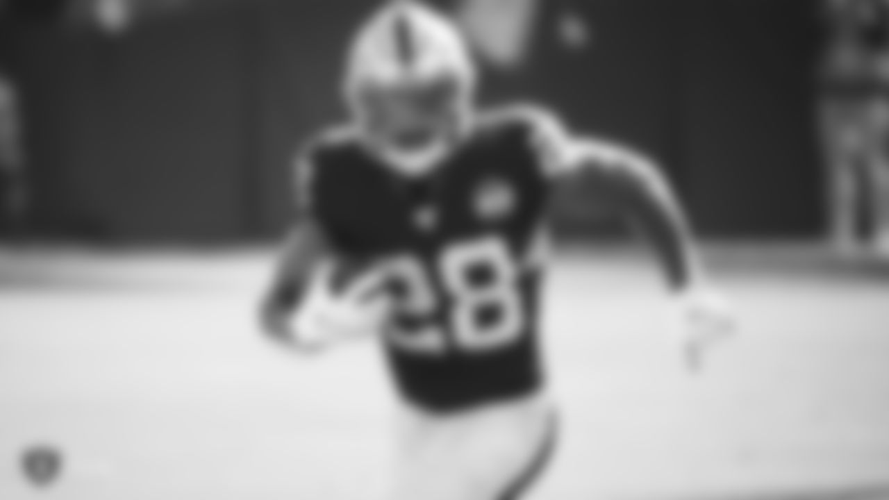 Raiders running back Josh Jacobs (28) rushes during the regular season game against the Detroit Lions.