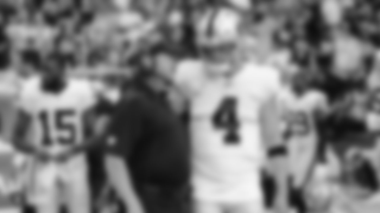 Raiders Head Coach Jon Gruden and quarterback Derek Carr (4) before the Raiders preseason game against the Arizona Cardinals.
