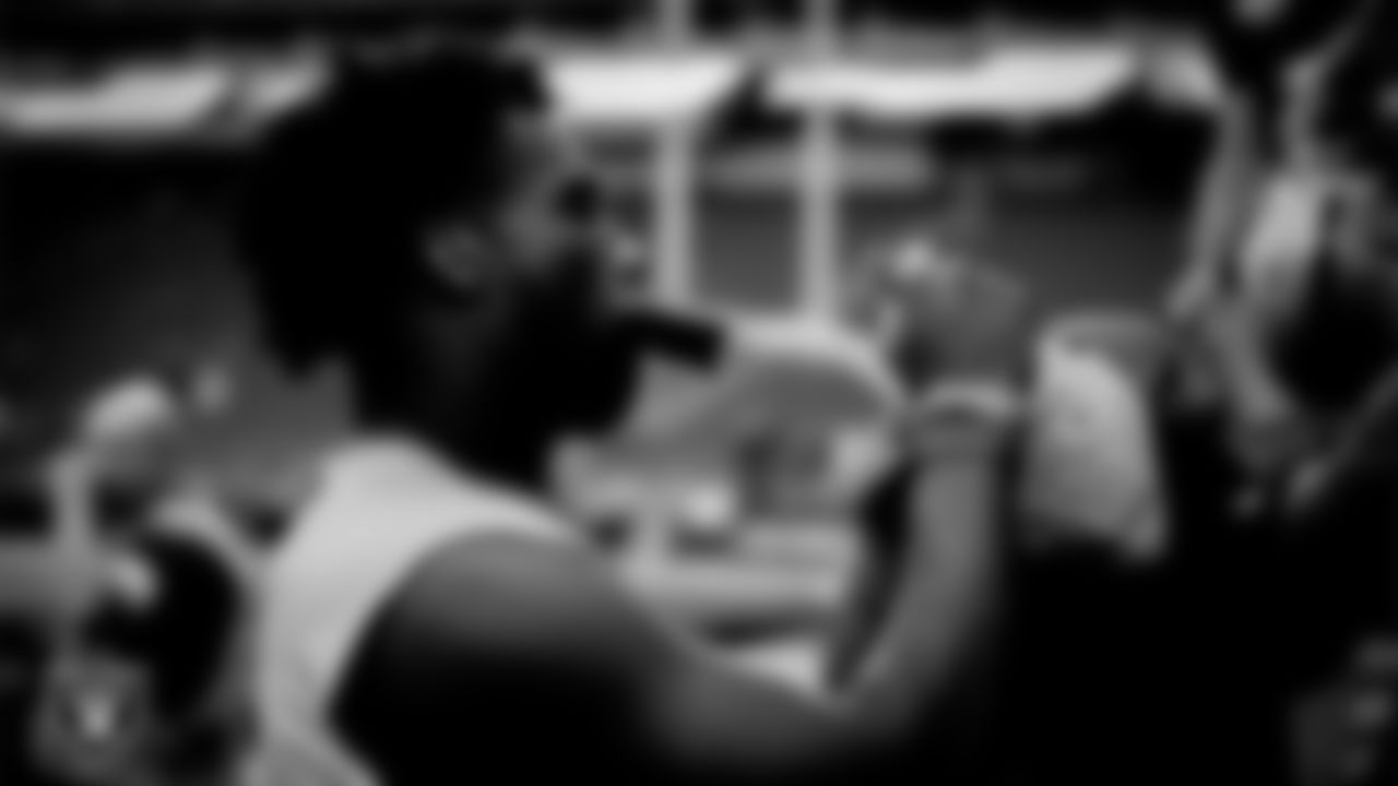 Las Vegas Raiders defensive end Malcolm Koonce (51) signs autographs for fans before the regular season home game against the Houston Texans at Allegiant Stadium.
