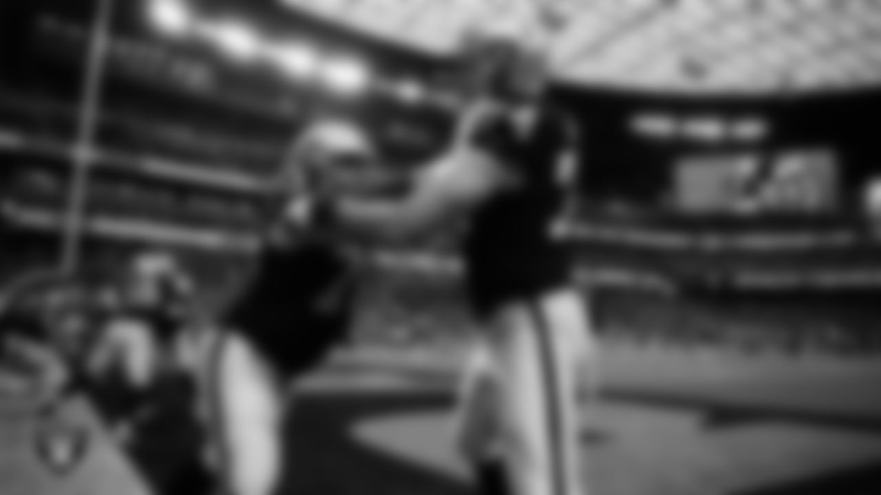 Las Vegas Raiders guard Greg Van Roten (70) and tackle Kolton Miller (74) warming up before the regular season home game against the Green Bay Packers at Allegiant Stadium.