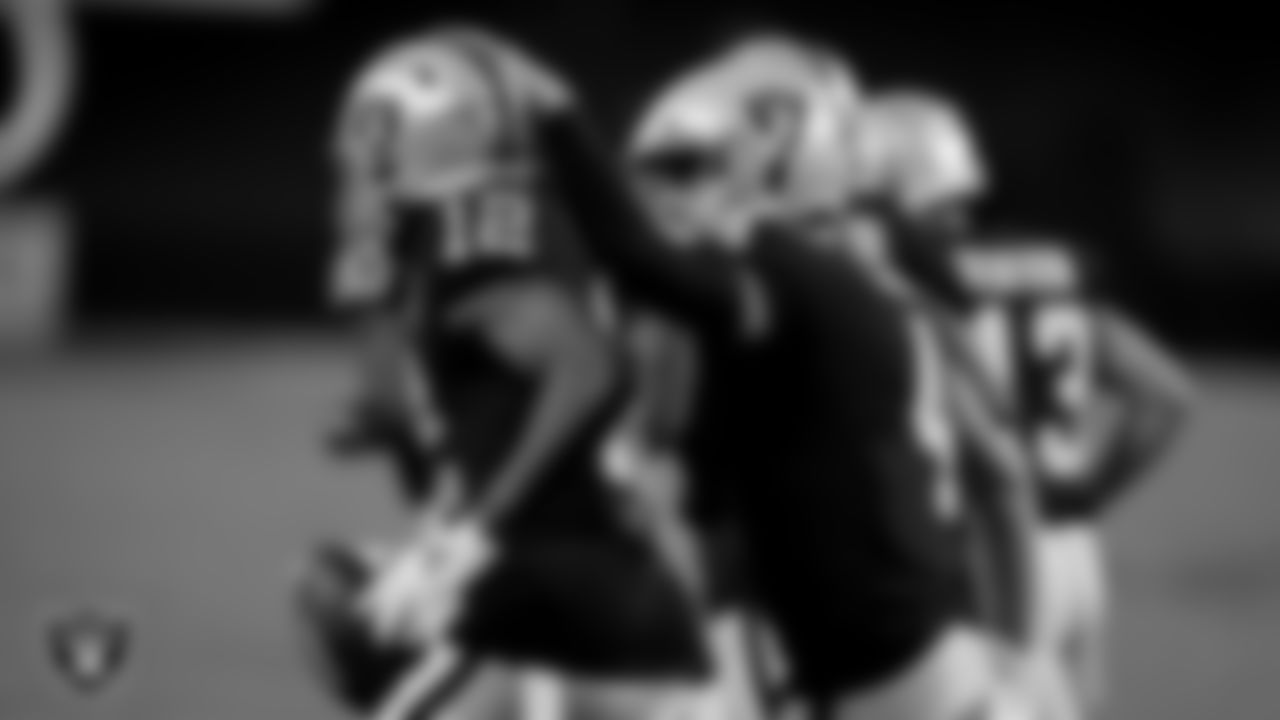 Las Vegas Raiders wide receiver Zay Jones (12) and quarterback Derek Carr (4) during the regular season game against the New Orleans Saints at Allegiant Stadium.