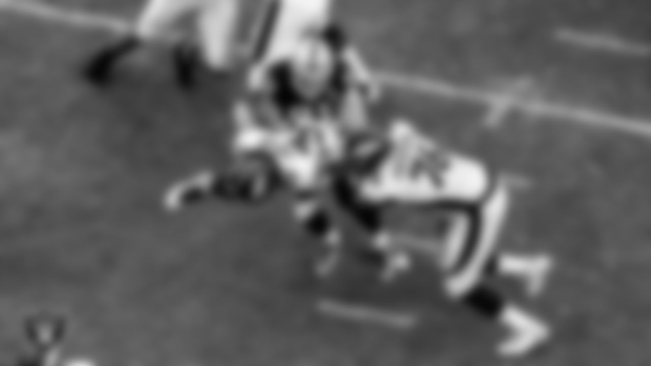 Las Vegas Raiders defensive end Maxx Crosby (98) makes a tackle during the regular season home game against the Denver Broncos.