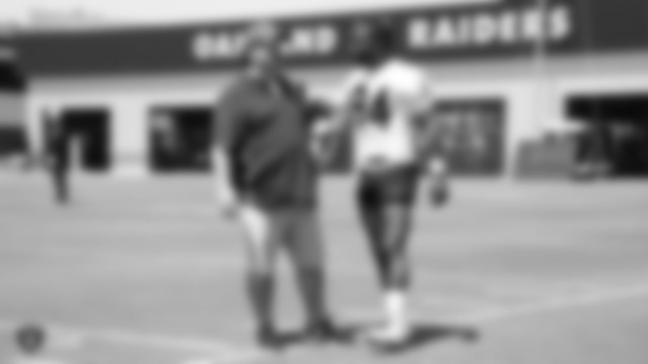 Raiders defensive coordinator Paul Guenther and wide receiver Antonio Brown (84) at an Organized Team Activity (OTA) at the Raiders Practice Facility in Alameda, Calif.