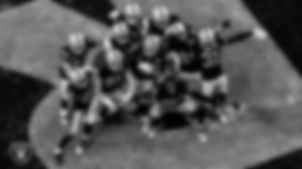 The Las Vegas Raiders celebrate after safety Jeff Heath (38) intercepted a pass during the regular season home game against the Denver Broncos.