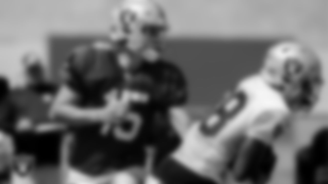 Las Vegas Raiders quarterback Chase Garbers (15) and running back Brittain Brown (38) during practice at Intermountain Healthcare Performance Center.
