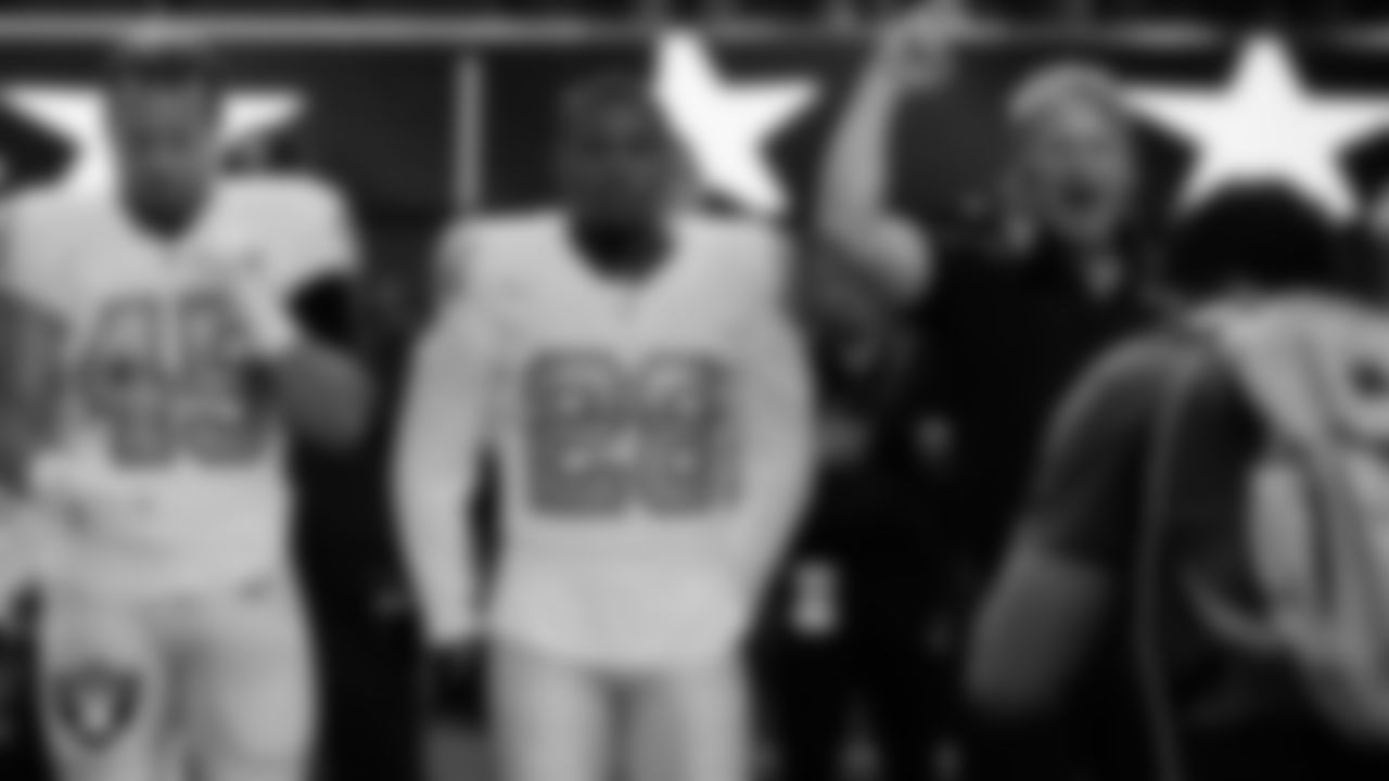 Las Vegas Raiders fullback Alec Ingold (45), running back Josh Jacobs (28) and Head Coach Jon Gruden during the national anthem before the regular season away game against the Los Angeles Chargers.