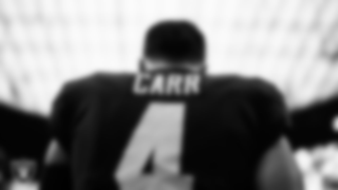 Las Vegas Raiders quarterback Derek Carr (4) warming up before the preseason home game against the New England Patriots at Allegiant Stadium.