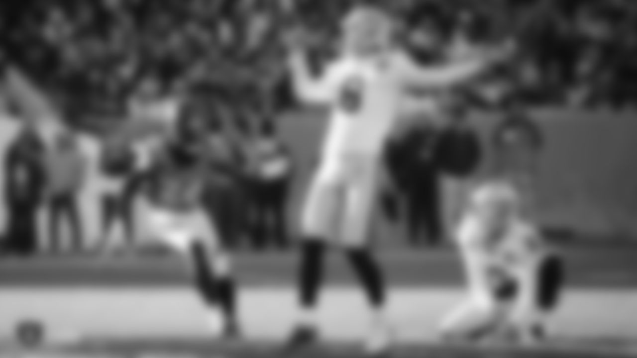 The Raiders during the regular season game against the Denver Broncos at Empower Field at Mile High.