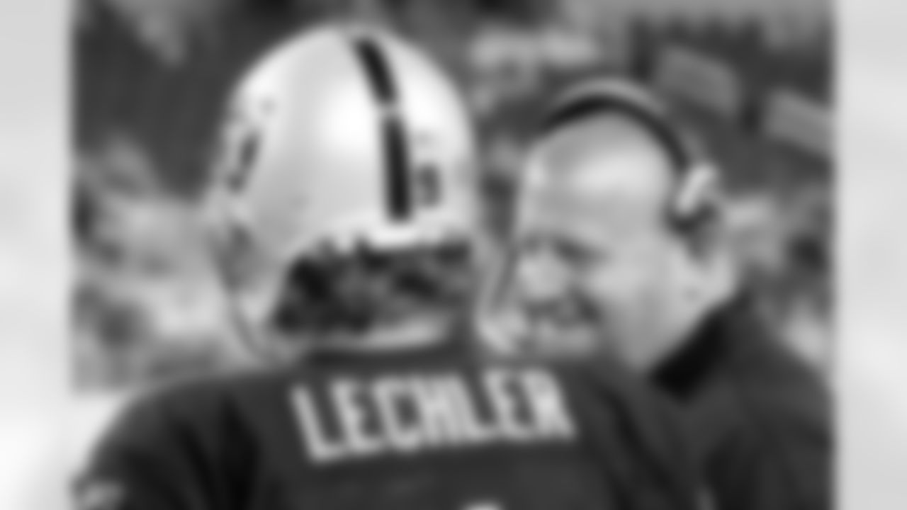 Head Coach Tom Cable chats with Pro Bowl P Shane Lechler. Photo by Tony Gonzales.