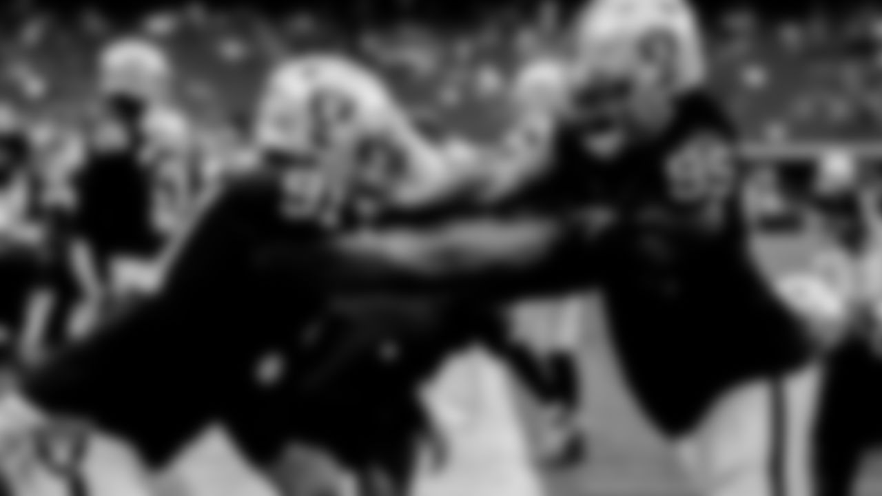 Las Vegas Raiders defensive tackle Bilal Nichols (91) and defensive end Kendal Vickers (95) warming up before the regular season home game against the Houston Texans at Allegiant Stadium.
