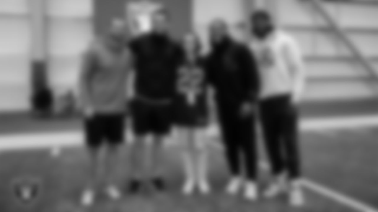 Ella Maldonado from the Make-A-Wish Foundation poses for a photo with wide receiver Hunter Renfrow (13), quarterback Derek Carr (4), running back Josh Jacobs (28) and wide receiver Davante Adams (17) during a visit to Intermountain Healthcare Performance Center.