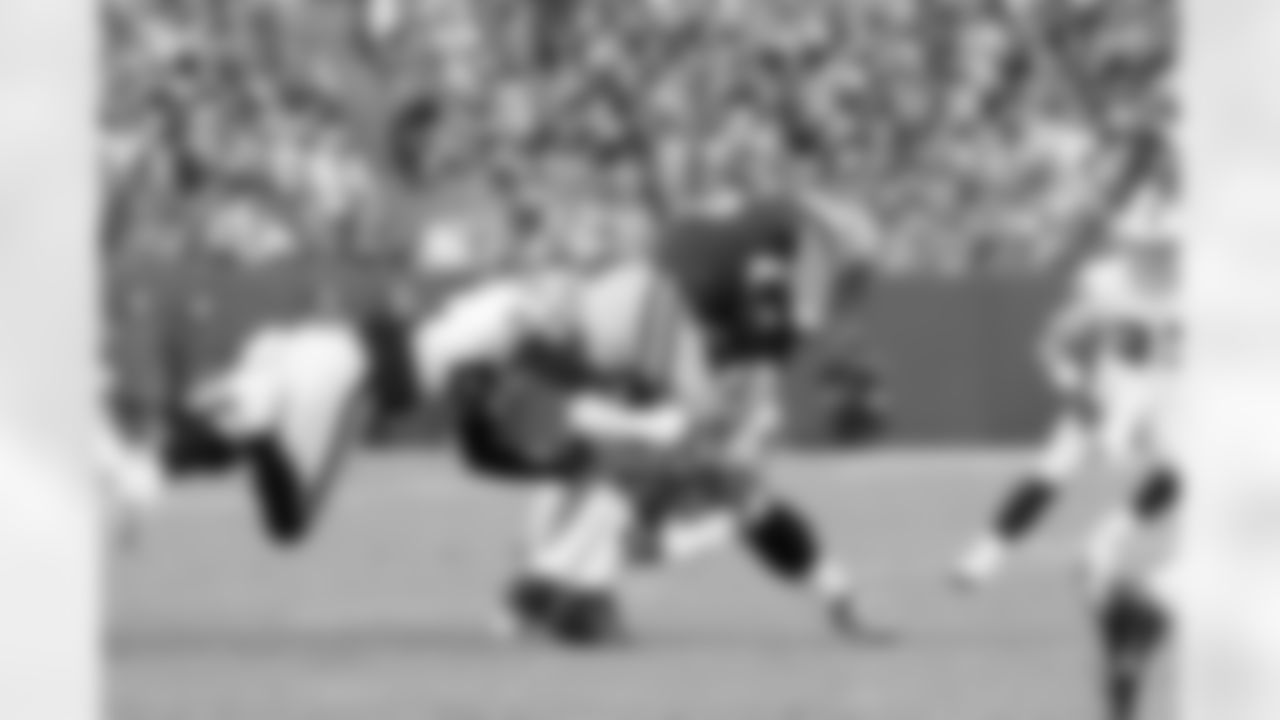 FS Michael Huff and DE Lamarr Houston make the tackle.