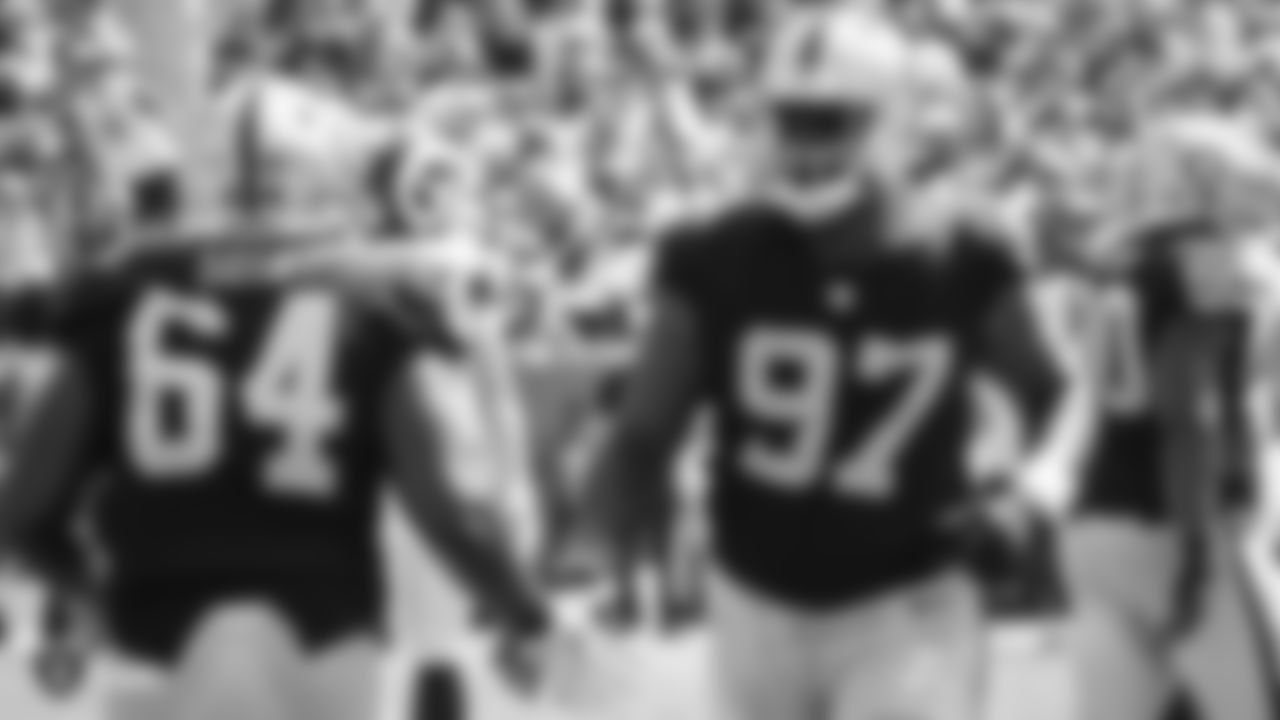 Oakland Raiders defensive lineman Shakir Soto (64) subs in for defensive end Mario Edwards Jr. (97) during The Oakland Raiders preseason game against the Los Angeles Rams at Los Angeles Memorial Coliseum, Saturday, August 18, 2018, in Los Angeles, California. The Oakland Raiders lost 19-15.