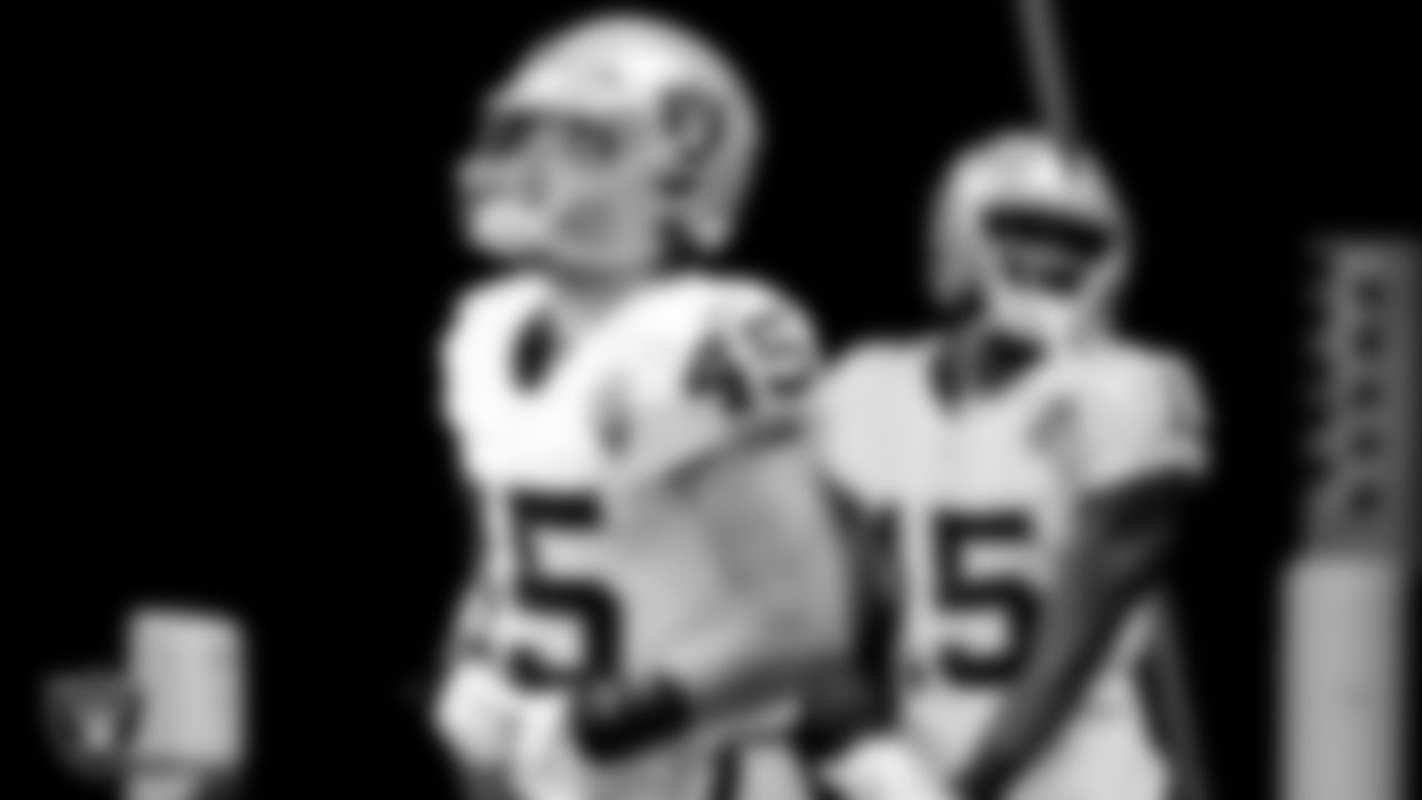 The Raiders warm up before the regular season game against the Atlanta Falcons at Mercedes-Benz Stadium.