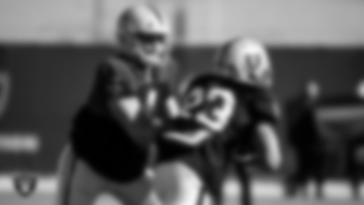 Las Vegas Raiders quarterback Derek Carr (4) and running back Devontae Booker (23) during practice.