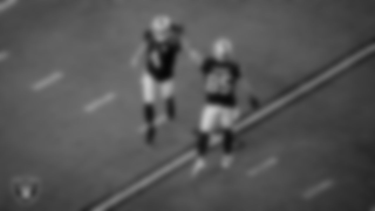 Las Vegas Raiders quarterback Derek Carr (4) and tight end Derek Carrier (85) during the regular season game against the New Orleans Saints at Allegiant Stadium.