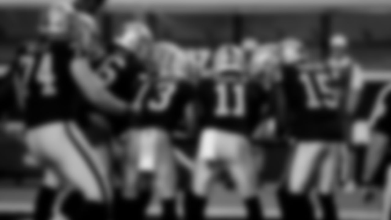 The Las Vegas Raiders celebrate a touchdown during the regular season game against the New Orleans Saints at Allegiant Stadium.