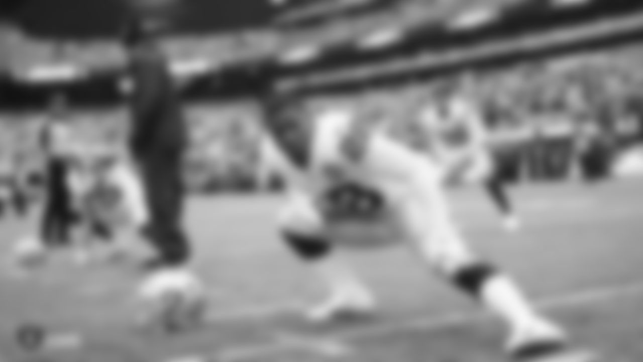 The Raiders warm up before the regular season game against the New York Jets.